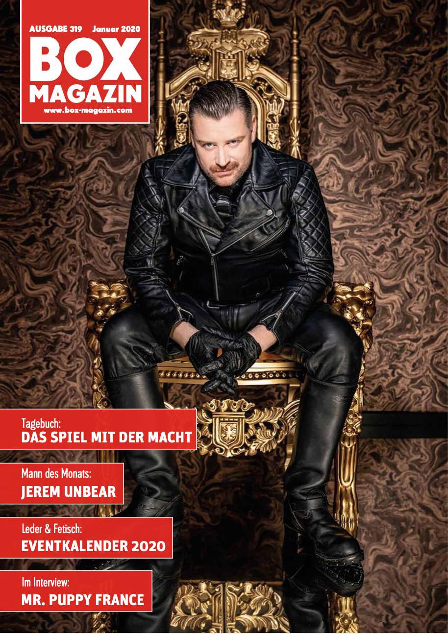 The dominus on the cover of BOX Magazin, sitting on a golden throne in full leather outfit, a lopsided grin and looking directly into the camera.